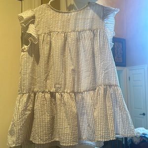 Cute casual top.  Ruffle sleeves sear sucker material wore one time.